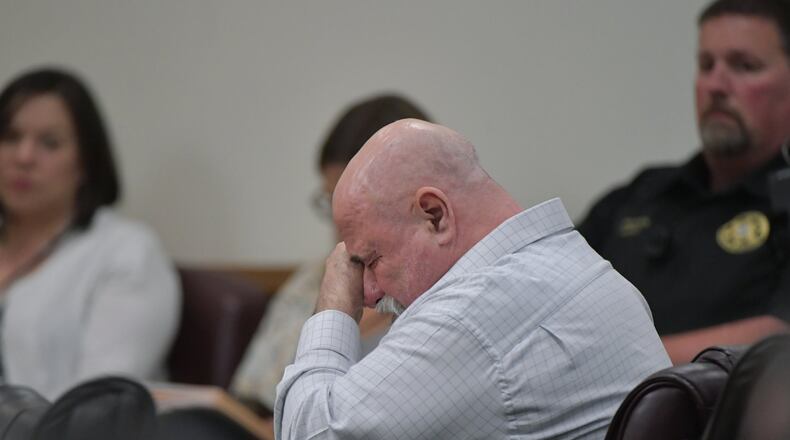 Franklin Gebhardt becomes emotional as one of his attorneys, Larkin Lee, makes closing arguments during his trial in the 1983 killing of Timothy Coggins. Coggins, a young black man, was stabbed some 30 times and then dragged by a pickup truck in rural Spalding County. HYOSUB SHIN / HSHIN@AJC.COM