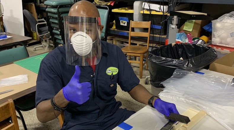 Kelvin Smith, a volunteer with Atlanta Beats Covid, works in the Decatur Makers makerspace to produce face shields that will be donated to Atlanta area healthcare workers. Contributed