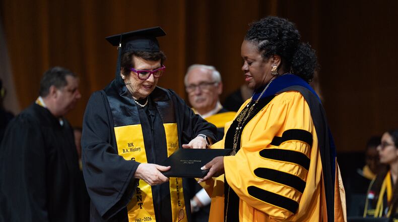Tennis legend Billie Jean King, left, receives her diploma from California State University, Los Angeles, President Berenecea Johnson Eanes during commencement in Los Angeles, Monday, May 18, 2026. (AP Photo/Jae C. Hong)