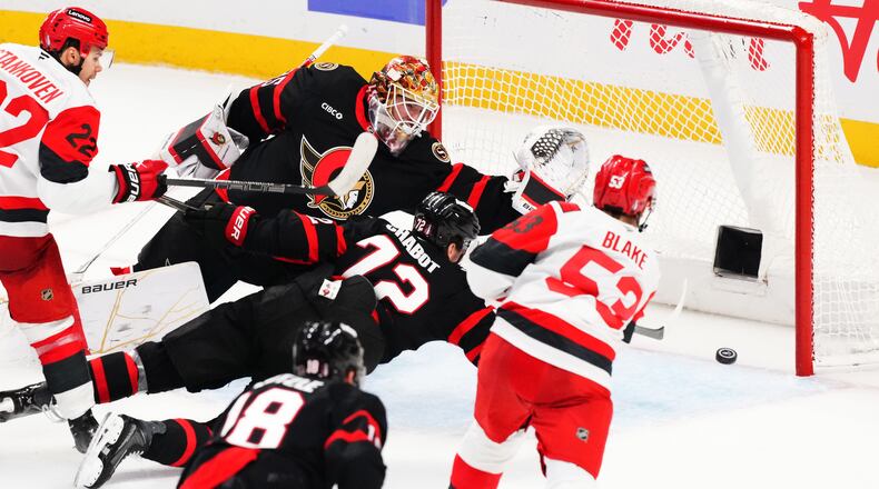 Carolina Hurricanes' Jackson Blake (53) scores on Ottawa Senators goaltender Linus Ullmark (35) as Senator's Thomas Chabot (72) defends during the second period of an NHL hockey playoff game in Ottawa, Ontario, Thursday, April 23, 2026. (Sean Kilpatrick/The Canadian Press via AP)
