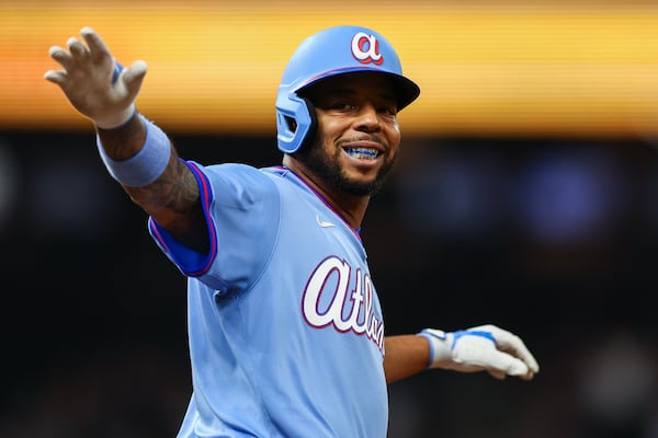 Braves designated hitter Dominic Smith reacts after hitting a two-run homer against the Guardians on Sunday. (Colin Hubbard for the AJC)