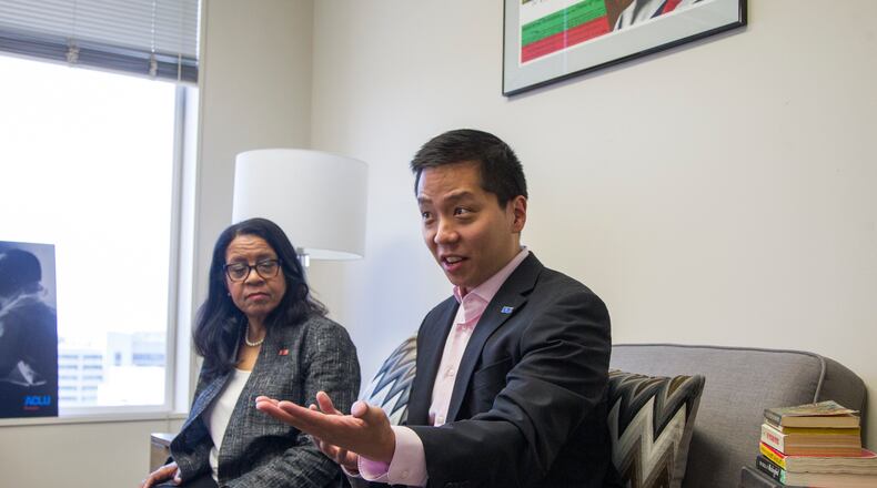 Sean Young, the legal director of the American Civil Liberties Union of Georgia, and the groupâs executive director, Andrea Young, speak at the Selig Building in Atlanta in April 2018. (REANN HUBER/REANN.HUBER@AJC.COM)