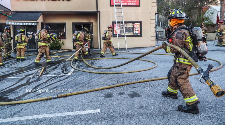 Atlanta fire crews put out a blaze at a northwest Atlanta dry cleaning business Wednesday morning.