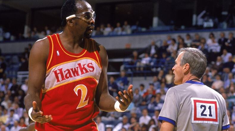 SEATTLE, WA - JANUARY 1: Moses Malone #2 of the Atlanta Hawks talks to a referee, during the NBA game against the Seattle SuperSonics at the Seattle Center in Seattle, Washington on January 1, 1989.