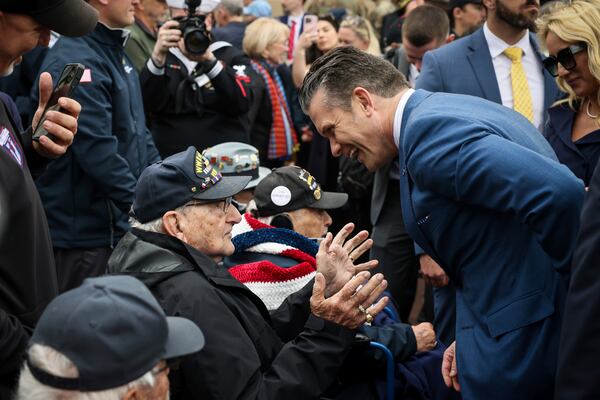 U.S. Defense Secretary Pete Hegseth, and his wife Jennifer Rauchet, right, meet American WWII veterans at the US cemetery as they commemorate the 81st anniversary of the D-Day landings, Friday, June 6, 2025 in Colleville-sur-Mer, Normandy. (AP Photo/Thomas Padilla)