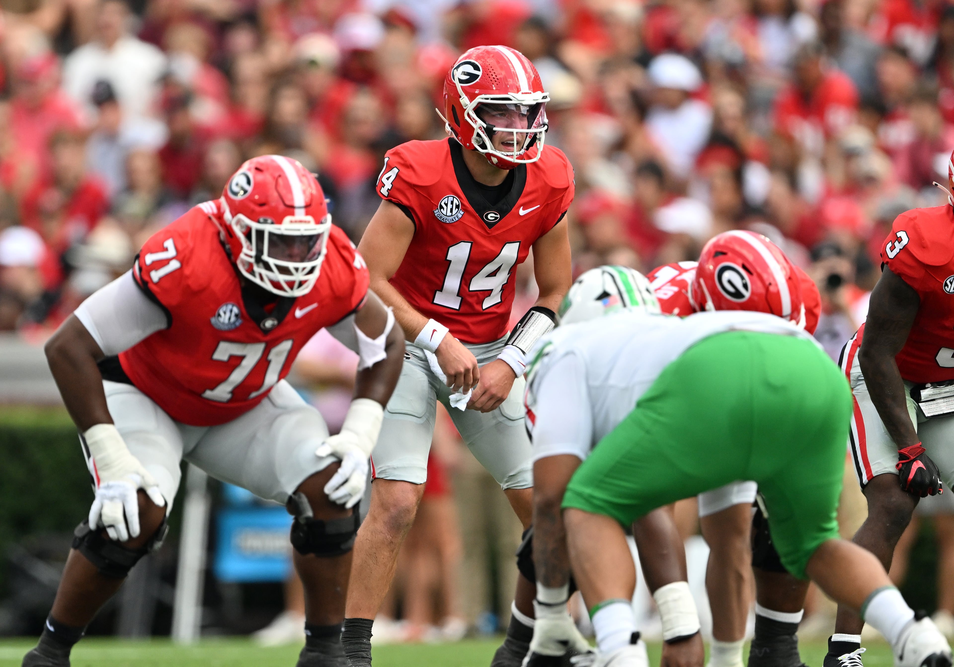 Georgia quarterback Gunner Stockton (14) shouts instructions during the first half in an NCAA football game at Sanford Stadium, Saturday, August 30, 2025, in Athens. (Hyosub Shin / AJC)