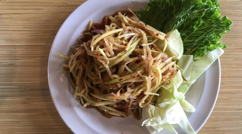 Green papaya salad is a funky, spicy pleasure at Snackboxe Bistro. CONTRIBUTED BY WYATT WILLIAMS