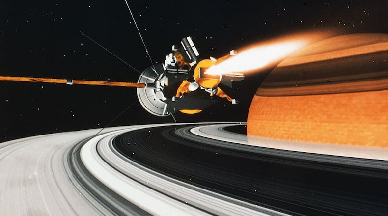 An illustration of the Cassini-Huygens spacecraft in orbit around Saturn. Cassini has been studying the sixth planet from the sun and its many moons since arriving in Saturn’s neighborhood in 2004. The little space lab is getting ready for the final phase of its mission, before plummeting directly into the planet in September in a kamikaze-style death spiral.