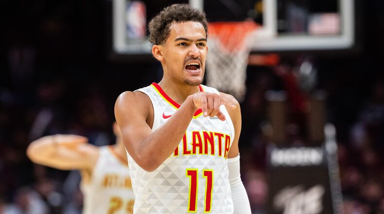 Trae Young of the Atlanta Hawks celebrates after the Hawks scored against the Cleveland Cavaliers during the second half at Quicken Loans Arena on October 21, 2018 in Cleveland, Ohio. The Hawks defeated the Cavaliers 133-111. (Photo by Jason Miller/Getty Images)