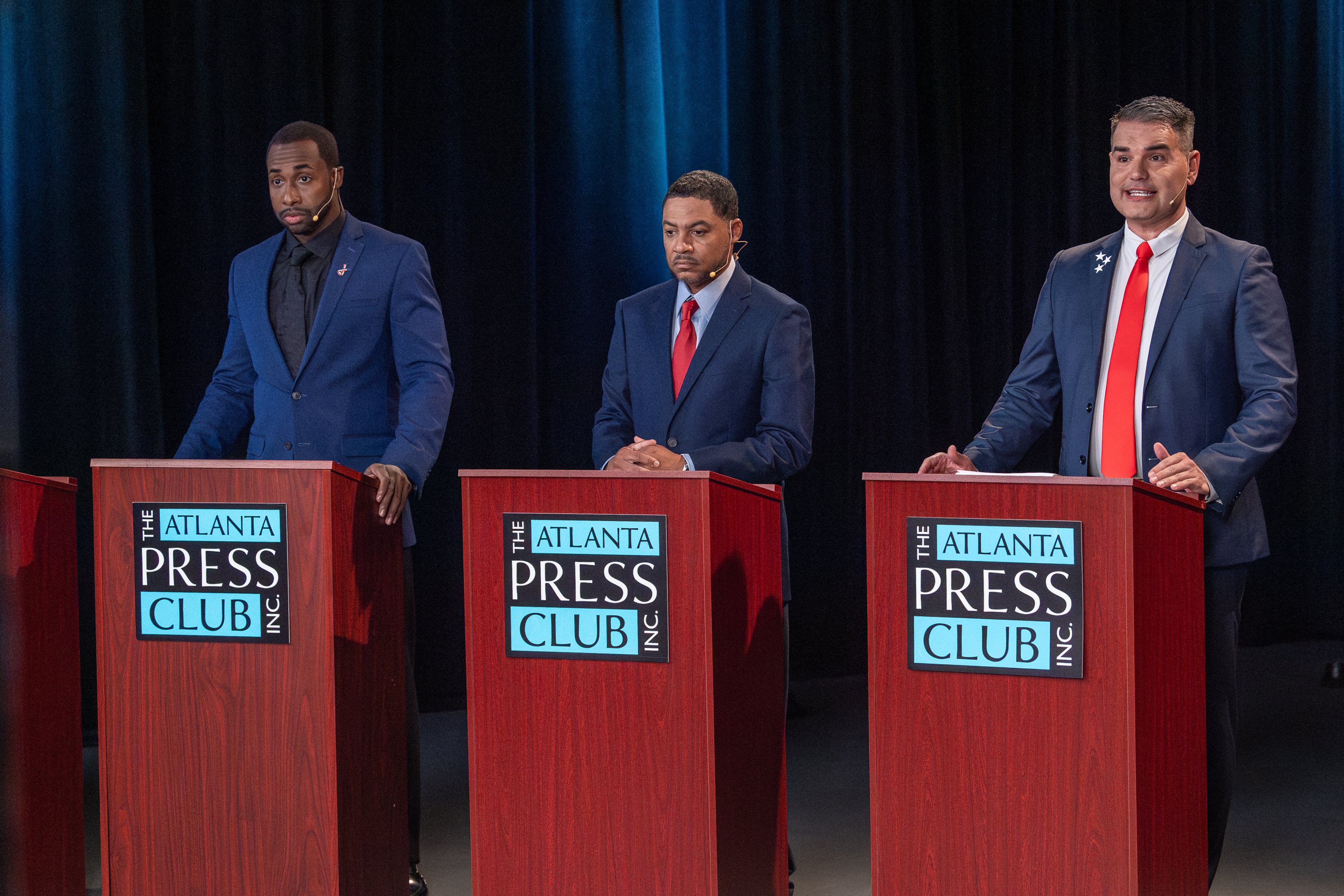 Candidates for mayor Eddie Andrew Meredith (left), Kalema Jackson (center) and Helmut Love Domagalski (right) take part in the Atlanta Press Club debate on Oct. 10, 2025.
