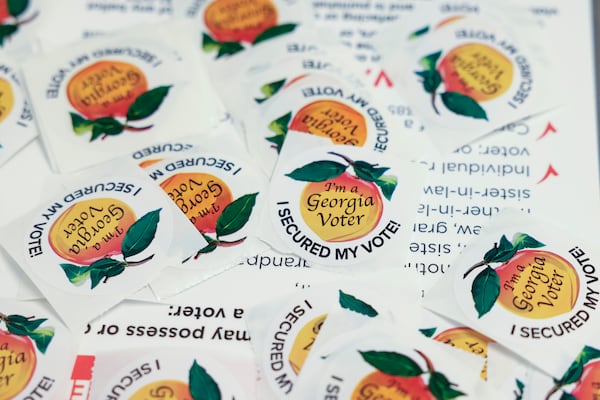 Georgia voting stickers are displayed at the Buckhead Library in 2024. (Jason Getz/AJC)