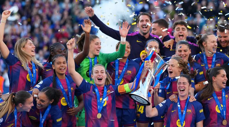 Barcelona's Alexia Putellas celebrates with the trophy after winning the Women's Champions League final soccer match between FC Barcelona and OL Lyonnes, in Oslo, Saturday, May 23, 2026. (AP Photo/Kirsty Wigglesworth)