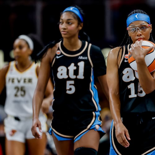 Atlanta Dream guard Allisha Gray (right) and forward Angel Reese react during the second half of a game against the Indiana Fever on Sunday, Aug. 16, 2026 at State Farm Arena in Atlanta. (Erik S. Lesser for the AJC)