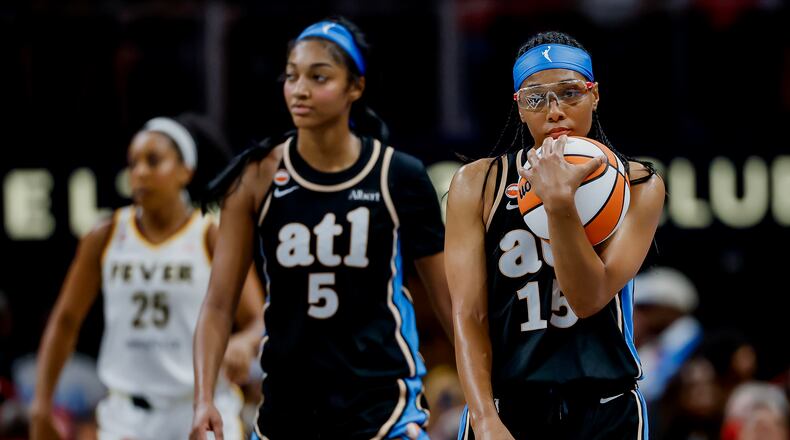 Atlanta Dream guard Allisha Gray (right) and forward Angel Reese react during the second half of a game against the Indiana Fever on Sunday, Aug. 16, 2026 at State Farm Arena in Atlanta. (Erik S. Lesser for the AJC)