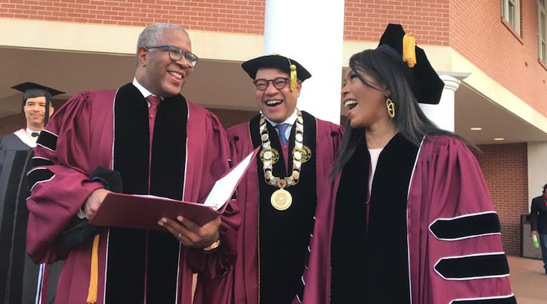 Tech billionaire Robert F. Smith (from left), Morehouse College President David Thomas and actress Angela Bassett prepare to walk to the graduation ceremonies at the college on Sunday, May 19, 2019. Smith and Bassett received honorary degrees.