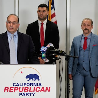 Dhillon Law Group partner Mike Columbo, second from left, speaks to reporters during a press conference announcing a federal lawsuit challenging Proposition 50, Wednesday, Nov. 5, 2025, in Sacramento, Calif. (AP Photo/Godofredo A. Vásquez)