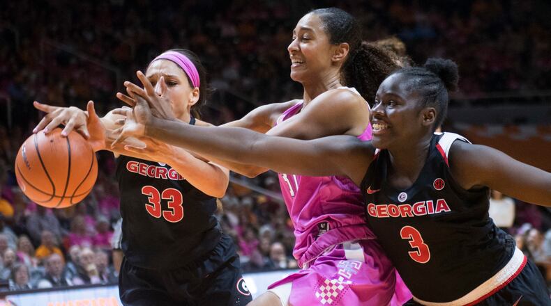 Tennessee's Jaime Nared chases after the ball with Georgia's Mackenzie Engram, left, and Stephanie Paul during an NCAA college basketball game in Knoxville, Tenn., Sunday, Feb. 11, 2018. (Saul Young/Knoxville News Sentinel via AP)