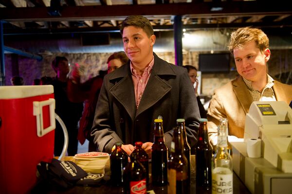 Taylor Miles (left) and Ramsey Jarun wait in line to try different beers during the Atlanta Winter Beerfest at the Masquerade in Atlanta on Sunday, Jan. 26, 2014. Beer lovers had the chance to try more than 90 local brews during the two-day event as well as listen to live music and play games. JONATHAN PHILLIPS / SPECIAL