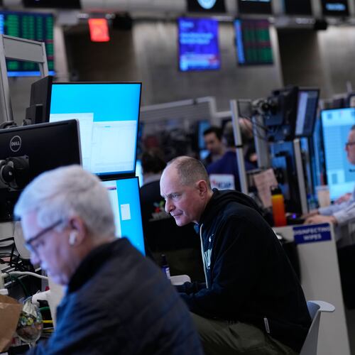 Traders work on the floor at the New York Stock Exchange in New York, Friday, Jan. 9, 2026. (AP Photo/Seth Wenig)