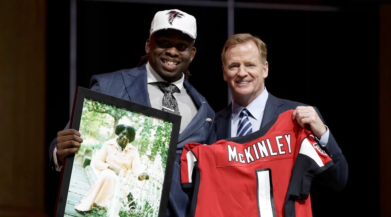 UCLA's Takkarist McKinley, left, poses with NFL commissioner Roger Goodell after being selected by the Atlanta Falcons during the first round of the 2017 NFL football draft, Thursday, April 27, 2017, in Philadelphia.