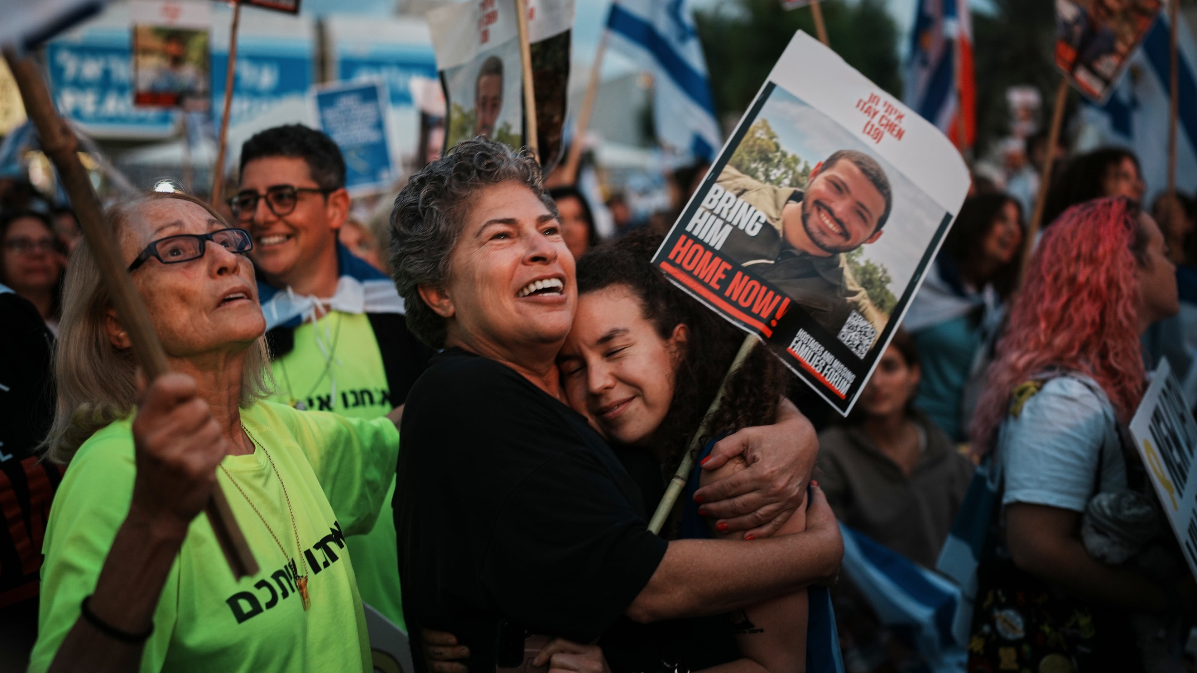 People gather prior to the release of Israeli hostages held in Gaza, at a plaza known as the hostages square in Tel Aviv, Israel, Monday, Oct. 13, 2025. (AP Photo/Emilio Morenatti)