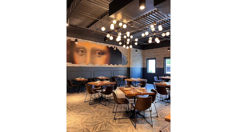 The interior of Grana in Dunwoody features a mural of Mona Lisa's eyes. / Courtesy of Grana