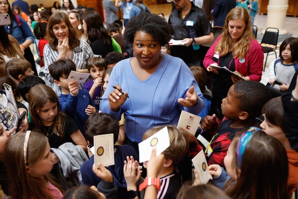 Stacey Abrams signs autographs for students at Talley Street Upper Elementary shortly after filing paperwork to qualify as a presidential elector at the Georgia State Capitol on Friday, March 8, 2024. (Natrice Miller/AJC)