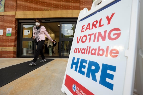 A voter leaves the early voting precinct for the Georgia Democratic primary at the South Fulton Southwest Arts Center last week. (Jason Getz/AJC)