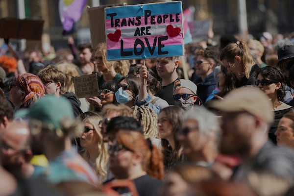 Campaigners take part in a rally organised by trans rights groups, trade unions, and community organisations following the Supreme Court ruling on the definition of a woman in equalities law, at Parliament Square, central London, Saturday April 19, 2025. (AP Photo/Alastair Grant)