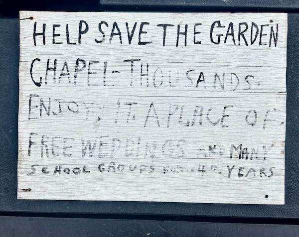 The back of a sign that hung on the front door of Howard Finster's World's Folk Art Church. The back of the sign urged the reader to help save the church. It remained closed for more than 25 years. Courtesy of Eddy Willingham