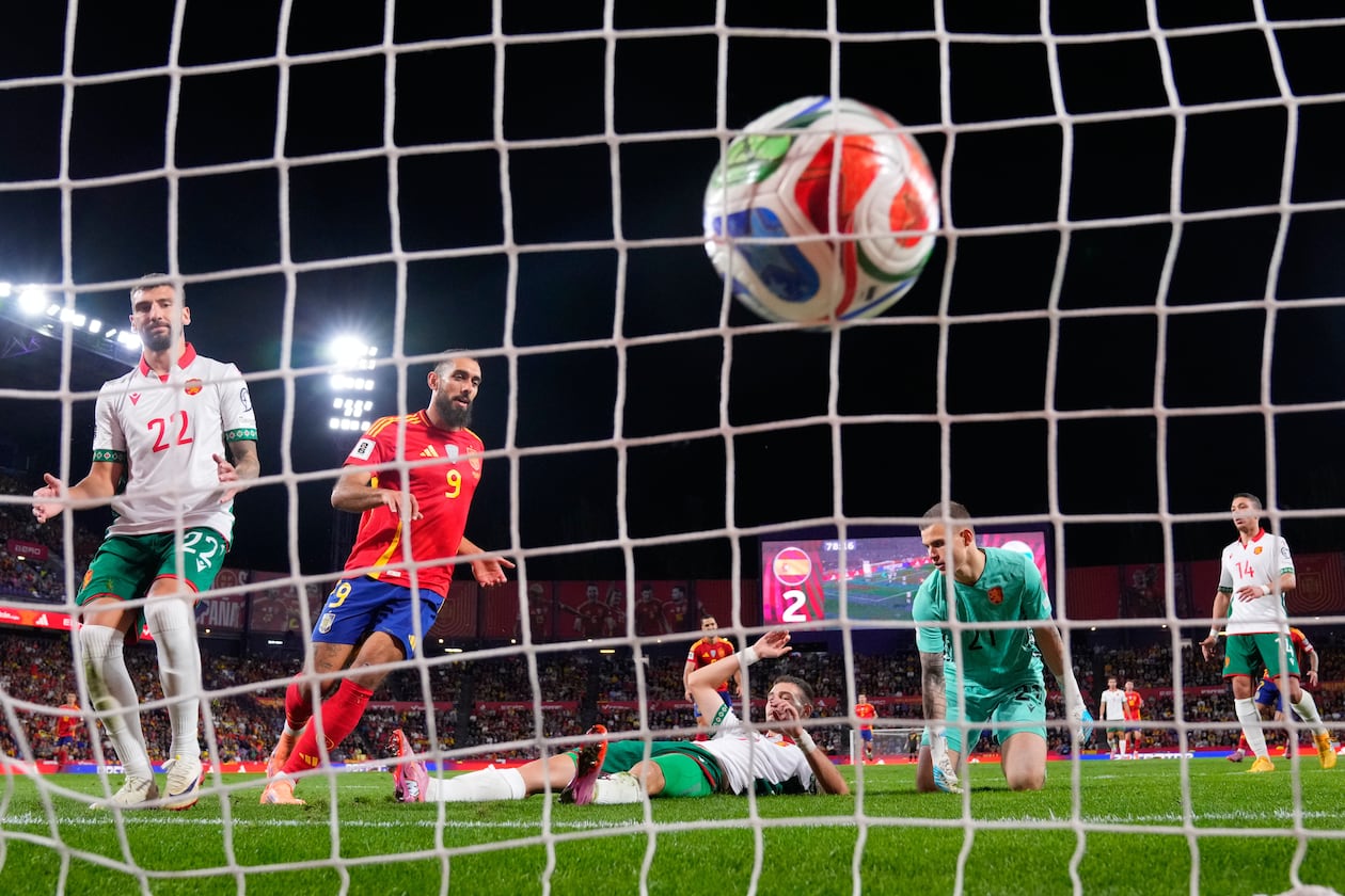 Bulgaria's Atanas Chernev, center, scores an own goal during the World Cup 2026 group E qualifying soccer match between Spain and Bulgaria in Valladolid, Spain, Tuesday, Oct. 14, 2025. (AP Photo/Manu Fernandez)