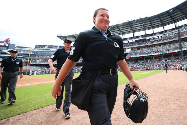 Jen Pawol walks off the Truist Park field after making history Sunday. 