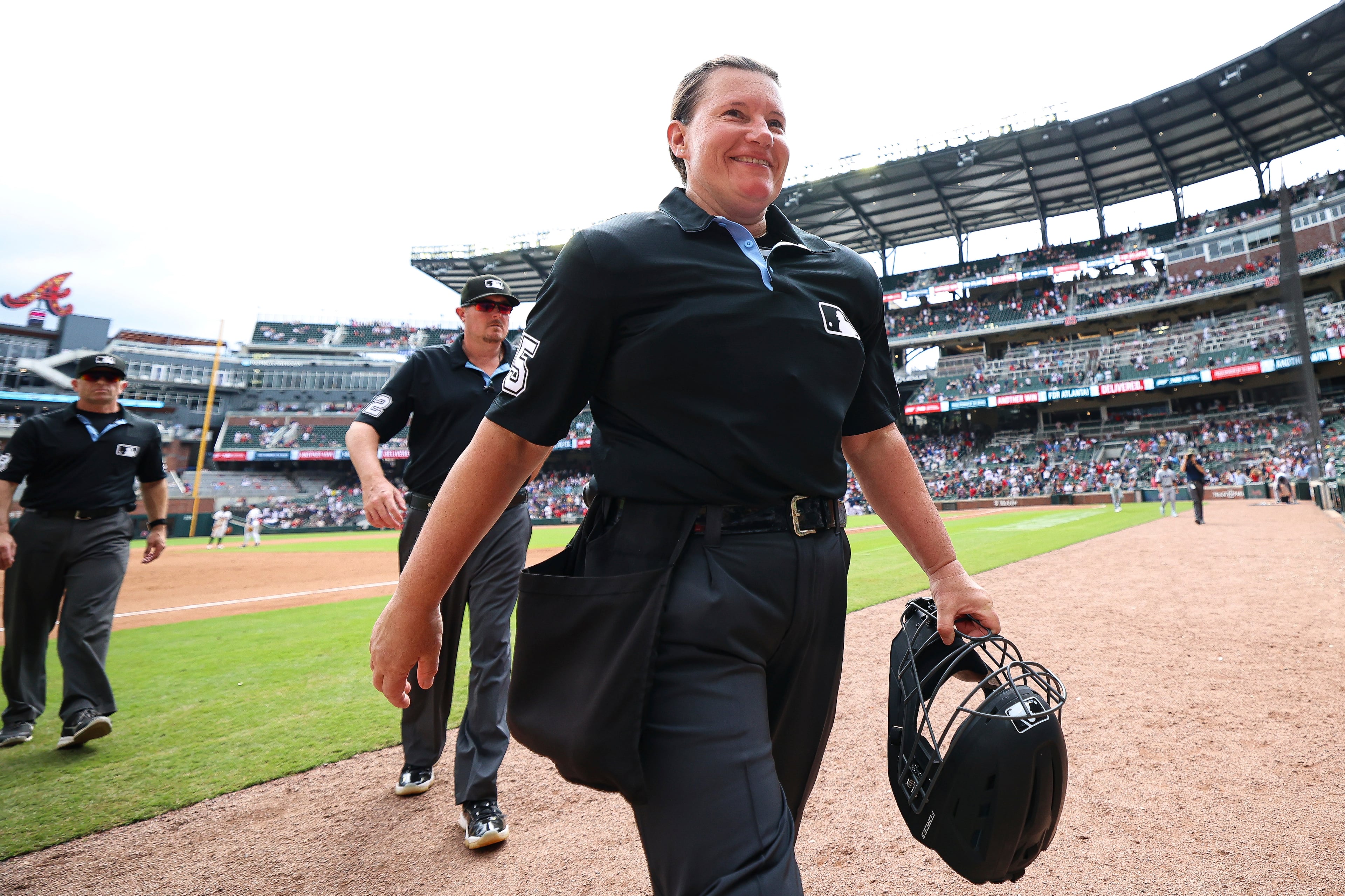 Jen Pawol walks off the Truist Park field after making history Sunday.