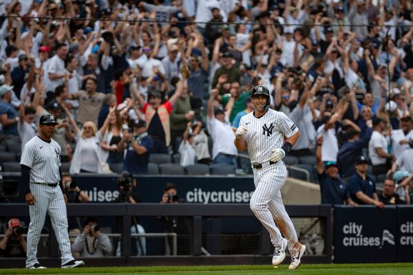 New York Yankees' Paul Goldschmidt (48) scores on Aaron Judge's grand slam during the third inning of the baseball game against the Milwaukee Brewers, Saturday, March 29, 2025, in New York. (AP Photo/Angelina Katsanis)