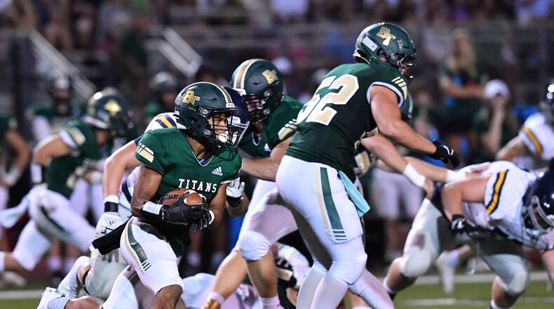 Blessed Trinity's Zach Bolden runs for a first down in 2021. Among current Class 6A schools, Blessed Trinity has the most victories over the past 10 seasons. (Hyosub Shin / Hyosub.Shin@ajc.com)