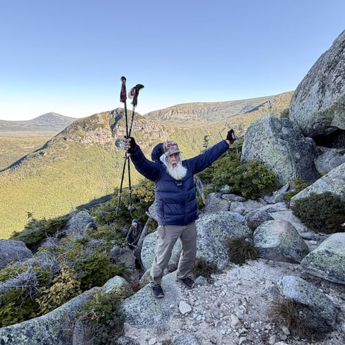 Dale Sanders, 91, celebrates after completing a difficult section of Mt. Katahdin, Monday, Aug. 31, 2026, in Baxter State Park in Piscataquis County, Maine. (AP Photo/Robert F. Bukaty)