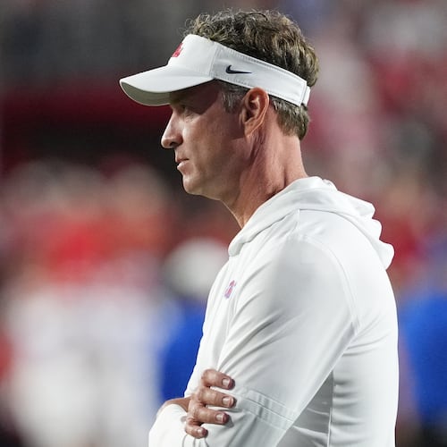 Mississippi head coach Lane Kiffin, watches his team warm up prior to the start of an NCAA college football game against Florida, Saturday, Nov. 15, 2025, in Oxford, Miss. (AP Photo/Rogelio V. Solis)