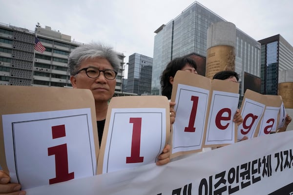 Protesters hold a sign that reads, "Condemning U.S. immigration enforcement." near the U.S. Embassy in Seoul, South Korea on Tuesday, Sept. 9, 2025 as they stage a rally against the detention of South Korean workers during an immigration raid in Georgia. (Ahn Young-joon/AP)