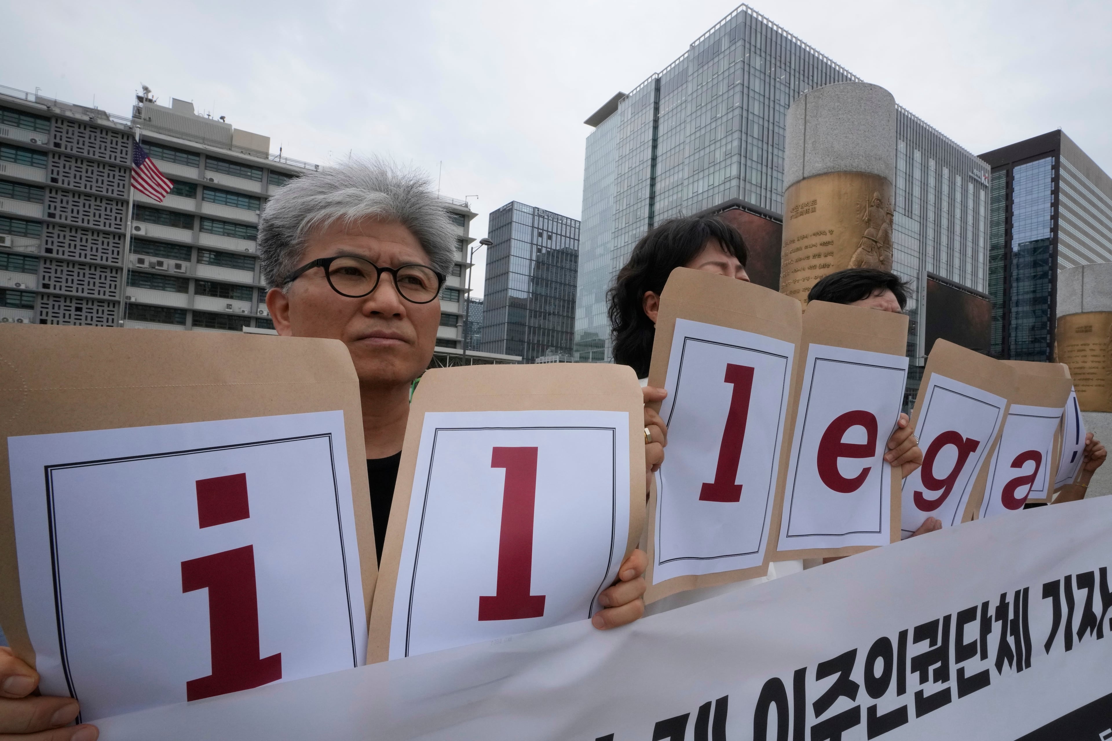 Protesters hold a sign that reads, "Condemning U.S. immigration enforcement." near the U.S. Embassy in Seoul, South Korea on Tuesday, Sept. 9, 2025 as they stage a rally against the detention of South Korean workers during an immigration raid in Georgia. (Ahn Young-joon/AP)