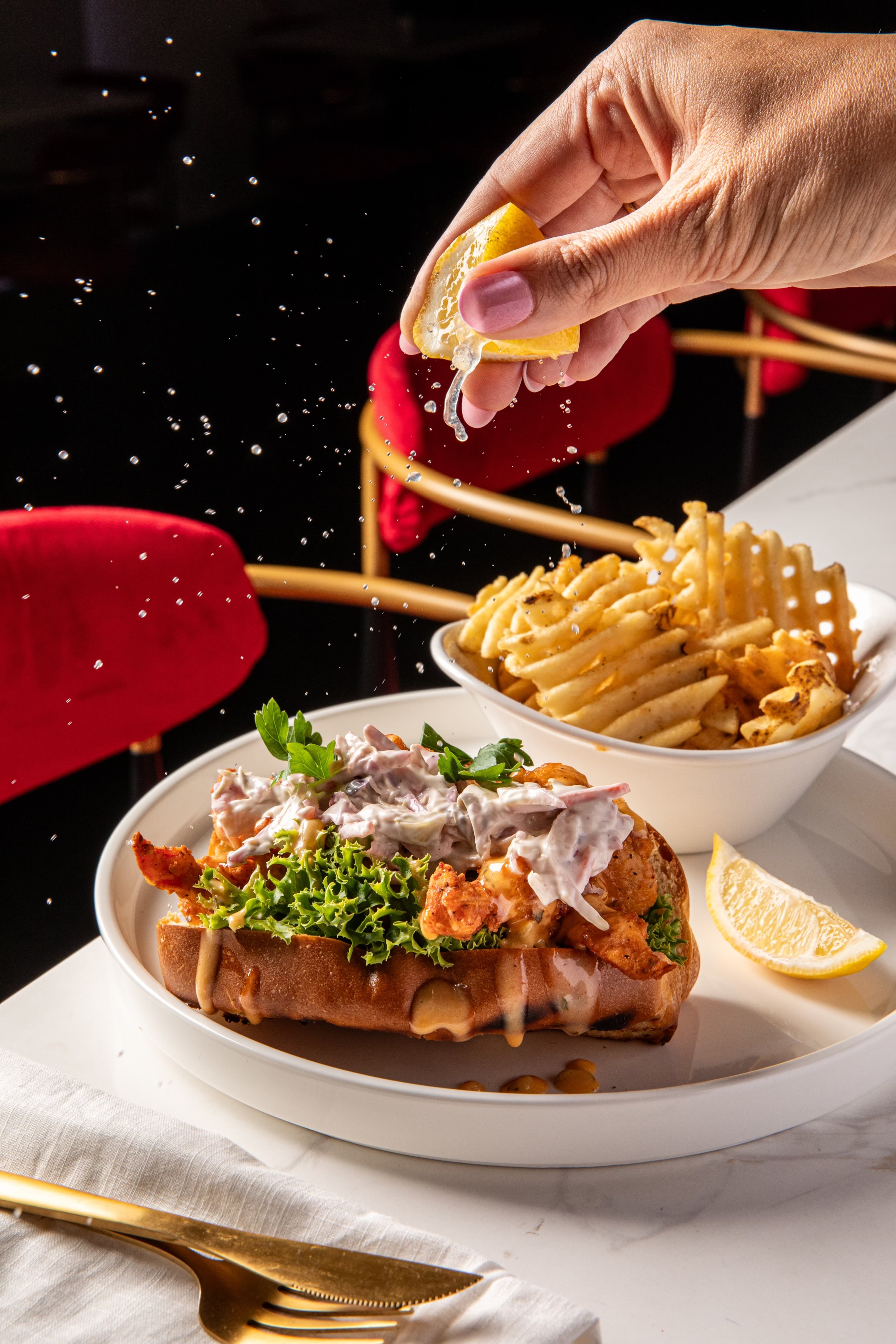 A lobster roll with fried lobster is on the menu at Red Room Bistro. (Courtesy of Madelynne Grace/Bites and Bevs Media)