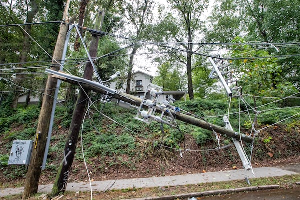 Significant power line damage from Hurricane Helene is shown on McClendon Avenue in Candler Park on Friday, Sept 27, 2024. Georgia Power has said it has hundreds of millions of dollars in unrecovered damages from the storm. (Jenni Girtman for the AJC)