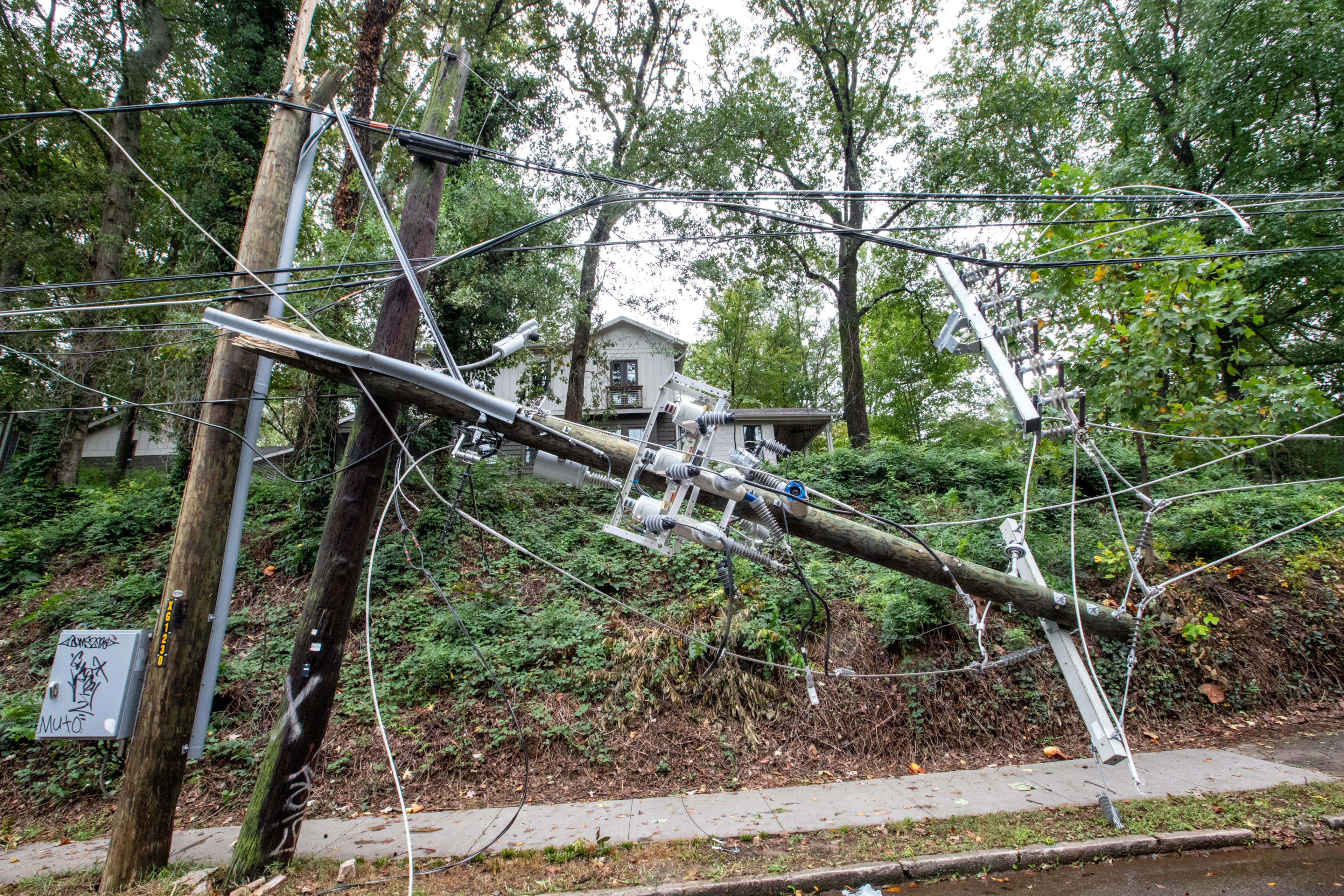 Significant power line damage from Hurricane Helene is shown on McClendon Avenue in Candler Park on Friday, Sept 27, 2024. Georgia Power has said it has hundreds of millions of dollars in unrecovered damages from the storm. (Jenni Girtman for the AJC)