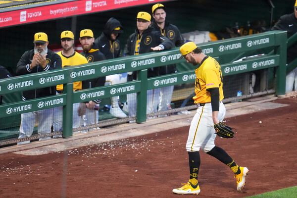 Pittsburgh Pirates pitcher Paul Skenes, right, walks to the dugout after pitching in the sixth inning of a baseball game against the Milwaukee Brewers in Pittsburgh, Friday, May 23, 2025. (AP Photo/Gene J. Puskar)