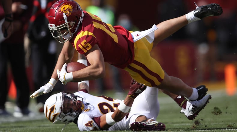 Drake London #15 of the USC Trojans collides with Chase Lucas #24 of the Arizona State Sun Devils during the first half of a game at Los Angeles Coliseum on November 07, 2020 in Los Angeles, California. (Photo by Sean M. Haffey/Getty Images/TNS)