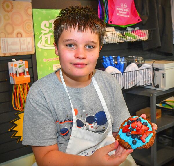Connor Kolwaite, 10, of Auburn, Ala., shows the fruits of his labor in the form of an Oatmeal Cookie Crust that he created during a recent class at Young Chefs Academy. CONTRIBUTED BY CHRIS HUNT PHOTOGRAPHY
