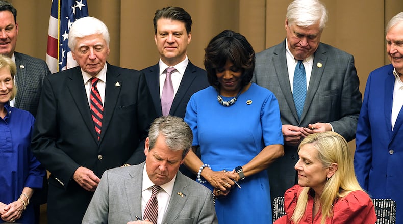 Governor Brian Kemp, First Lady Marty Kemp, health care advocates, and legislators were on hand for the signing of HB 1339 (the Certificate of Need bill) in Athens on Friday, April 19, 2024. (Nell Carroll for The Atlanta Journal-Constitution)