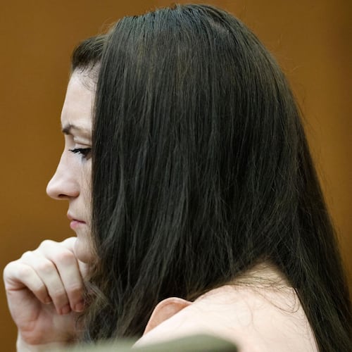 Defendant Lindsay Clancy wipes away tears as she listens to testimony during the Lindsay Clancy murder trial in Plymouth Superior Court, Plymouth, Mass., on Tuesday, Aug. 25, 2026. (Greg Derr/The Patriot Ledger via AP, Pool)