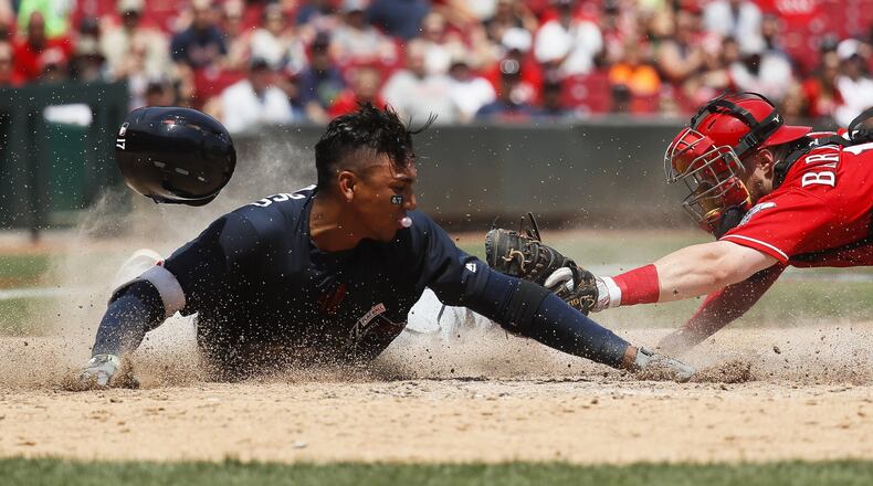 Johan Camargo will stay with the Braves as a bench player. (AP Photo/John Minchillo)