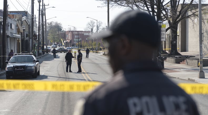 Police block off a section of Ralph David Abernathy Boulevard after a shooting at West End mall in Atlanta on Friday. (DAVID BARNES / SPECIAL)