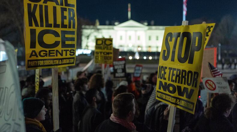 Demonstrators protest outside the White House earlier this year after a U.S. Immigration and Customs Enforcement agent fatally shot Renee Nicole Good in Minnesota. (Jose Luis Magana/AP)
